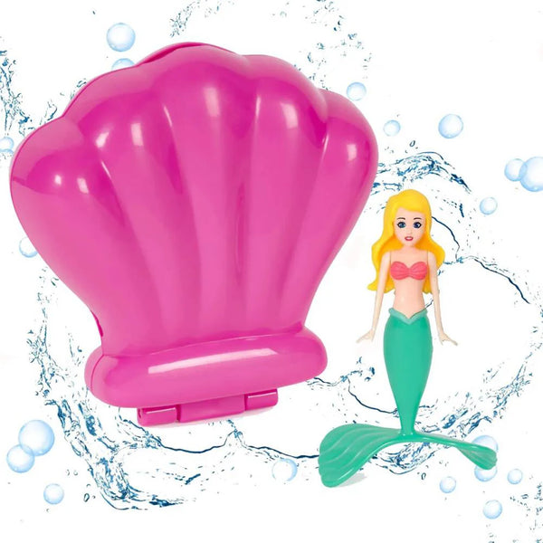 A pink seashell-shaped dive toy and a mermaid figure with a green tail floating in water.