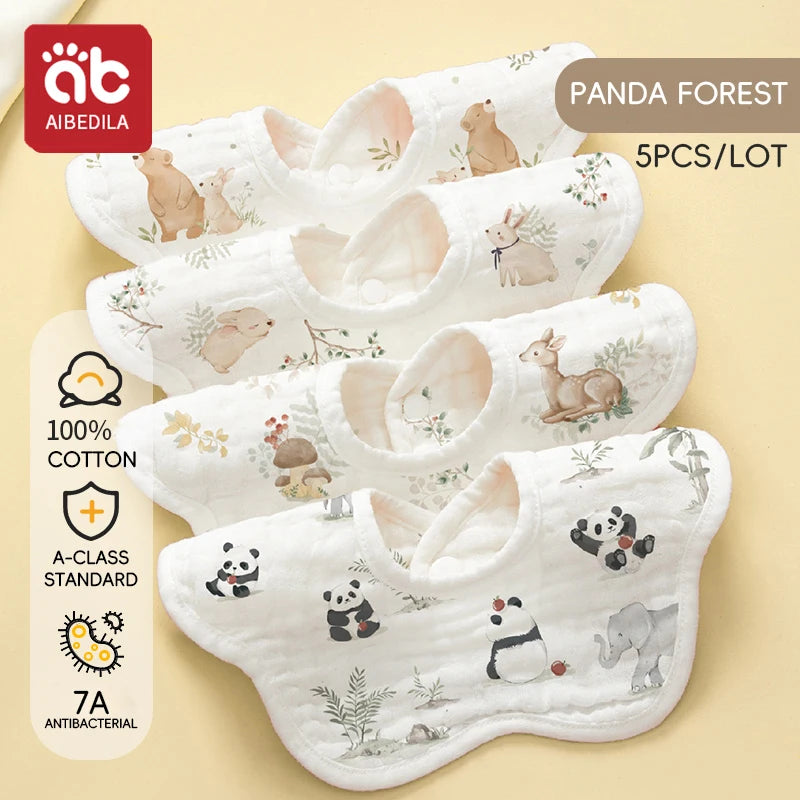 A pack of five white cotton muslin bandana bibs featuring cute panda and wildlife designs for babies
