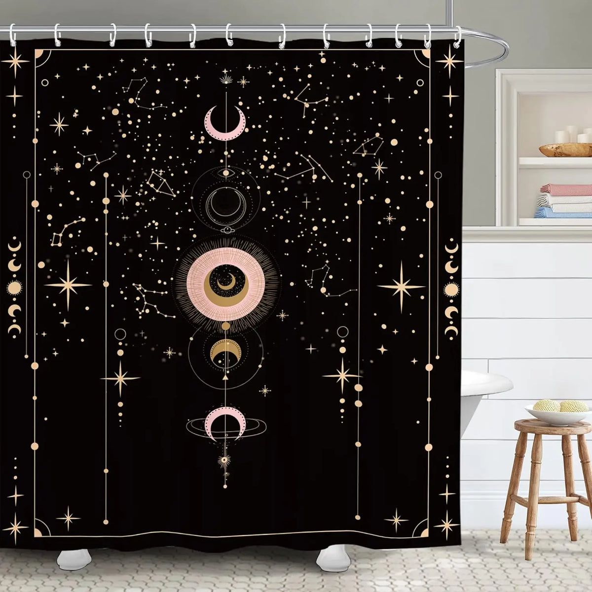 A black shower curtain featuring a bold design of celestial bodies, including moons, stars, and dots.
