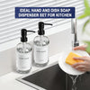 A set of two clear glass hand and dish soap dispensers with stainless steel pumps on a kitchen sink