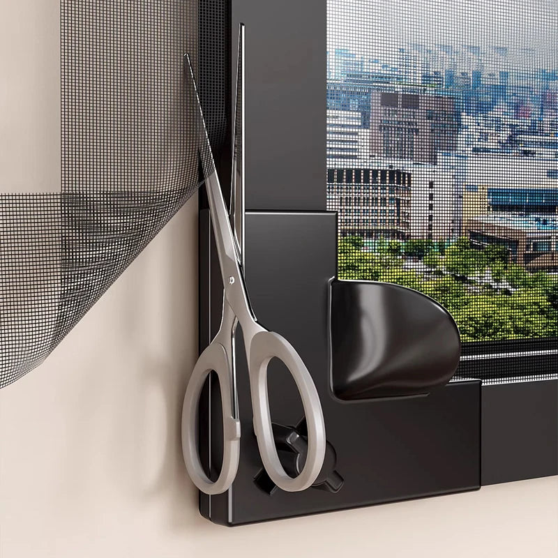 A pair of silver scissors is displayed next to a black magnetic window mosquito net frame.