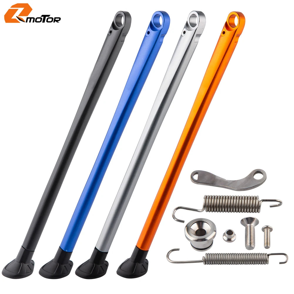 Set of three KTM side stand kits in black, blue, and orange with ABS feet and various hardware components