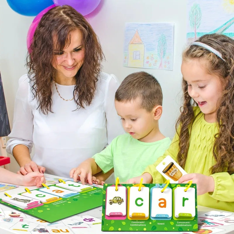 A woman and two children play with a Word Builder Flash Card Game for Kids Ages 3-6 featuring green cards and yellow componen
