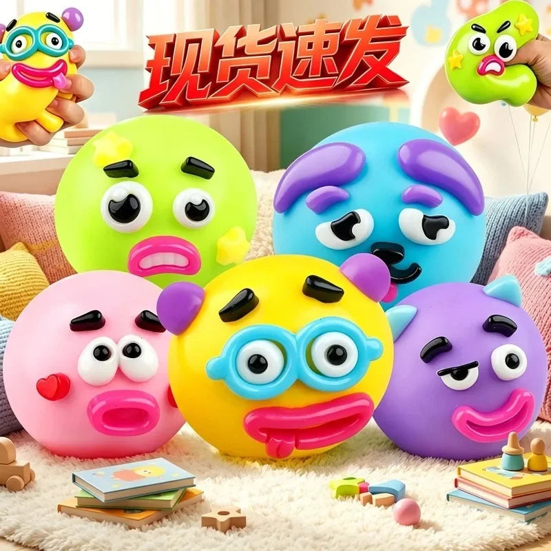 A collection of colorful face-changing squishy toys in green, blue, pink, and yellow are displayed on a white surface.