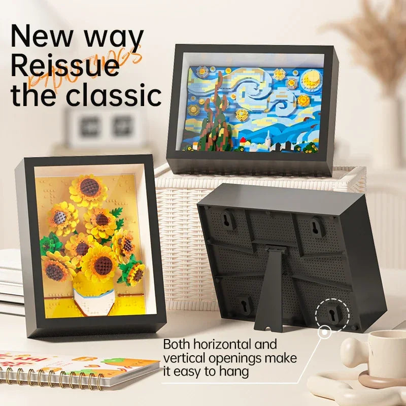 A black framed art piece featuring a yellow sunflower painting displayed next to a black wall-mounted block set.