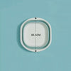 A white foldable plastic wash basin shown with dimension markings on a light blue background.