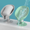 A leaf-shaped soap dish with a self-draining tray is shown, featuring a white and mint green color scheme.