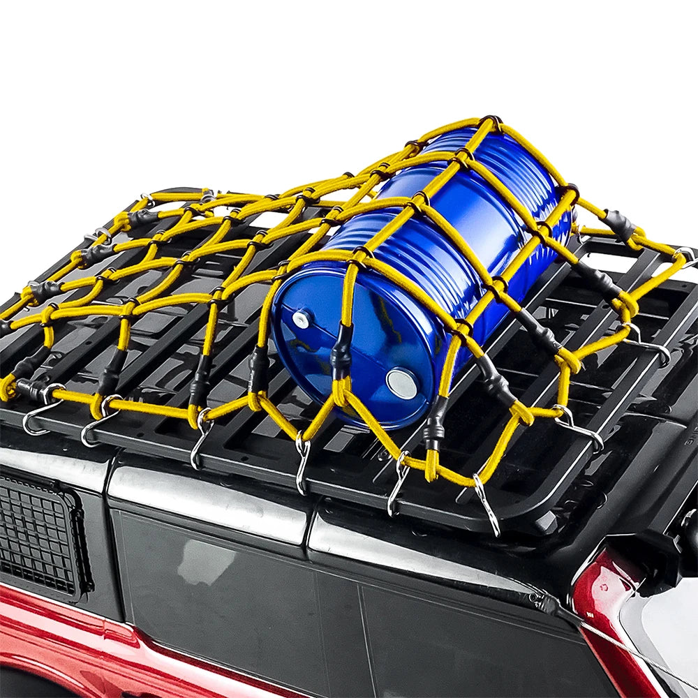Blue elastic roof rack luggage net with yellow straps installed on a black RC crawler vehicle.