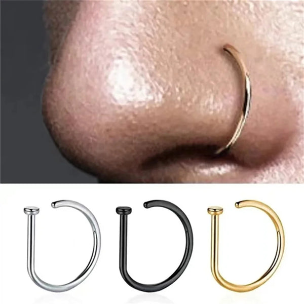 A set of non-piercing septum clips in silver, black, and gold metal finishes.