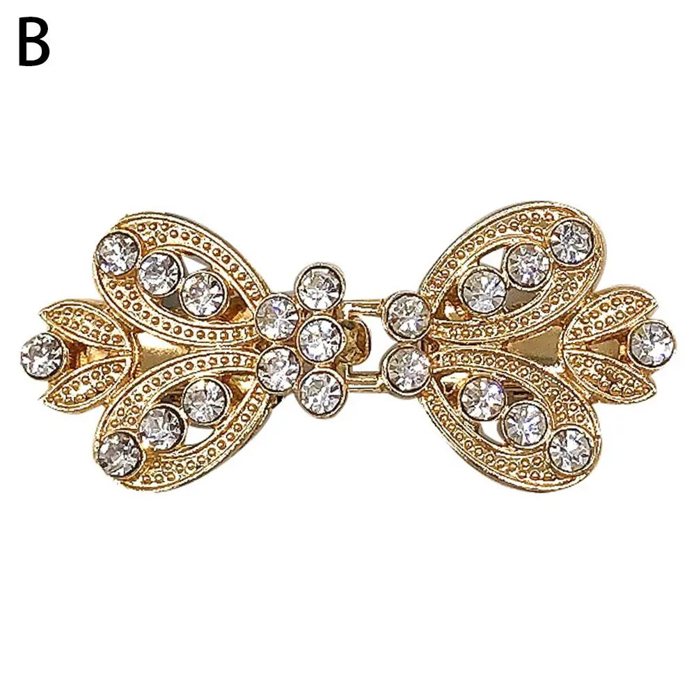 Gold vintage swirl sweater clip featuring clear rhinestones for cardigans and shawls