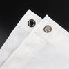 White HDPE privacy screen material with grommets, shown in a close-up view.