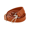 A brown leather strap with a gold-toned buckle is coiled and displayed on a white background.