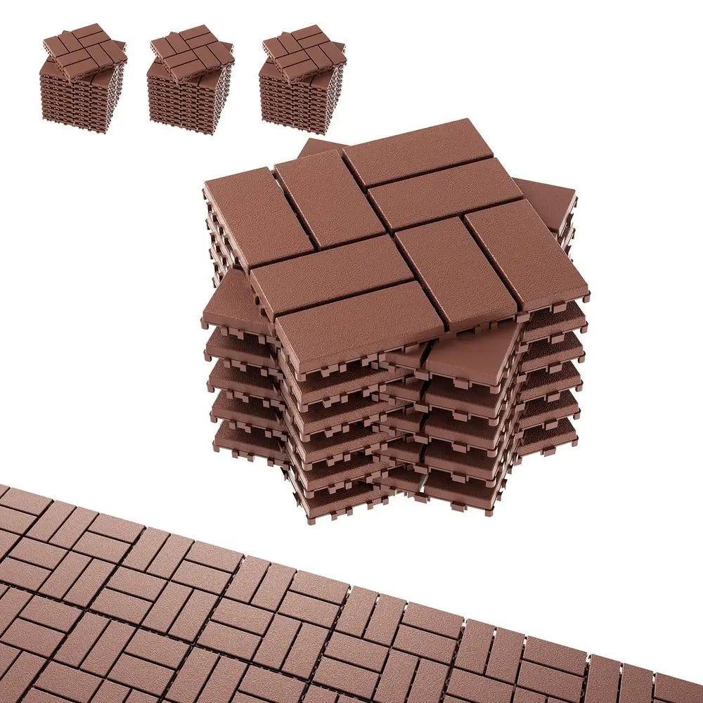 A stack of interlocking brown deck tiles, some loose pieces, and a section of laid tiles.