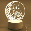 A white acrylic LED night light shaped like a crescent moon with Islamic calligraphy and stars.