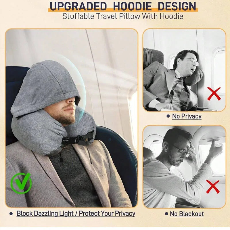 A gray hooded travel pillow with a hoodie design shown in use on an airplane seat.