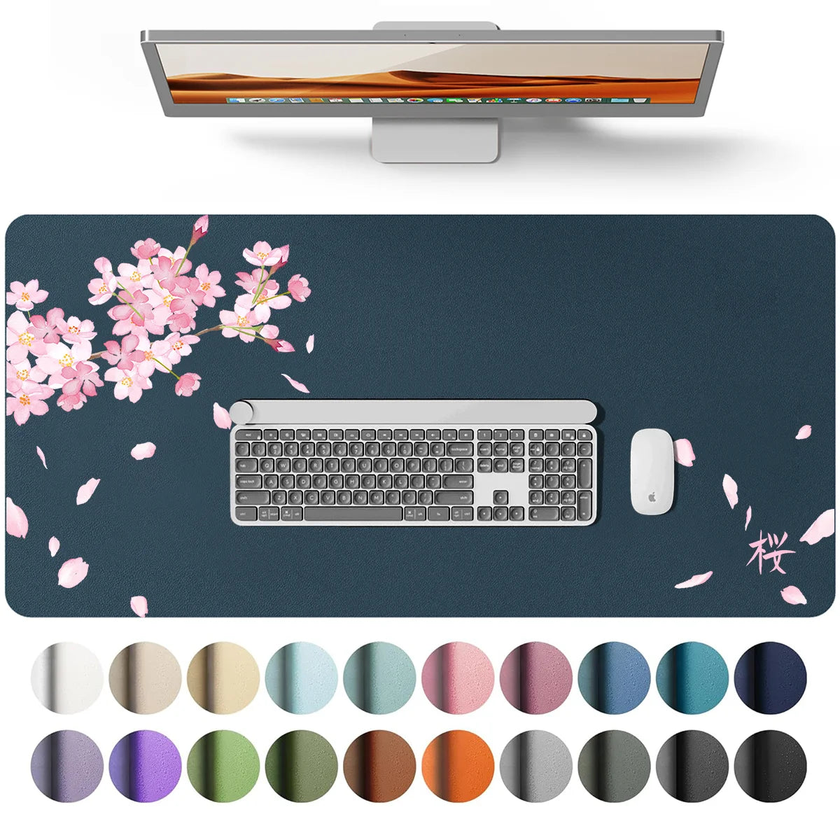 A waterproof PU leather desk pad featuring a laptop, keyboard, and mouse on a dark surface with pink cherry blossoms.