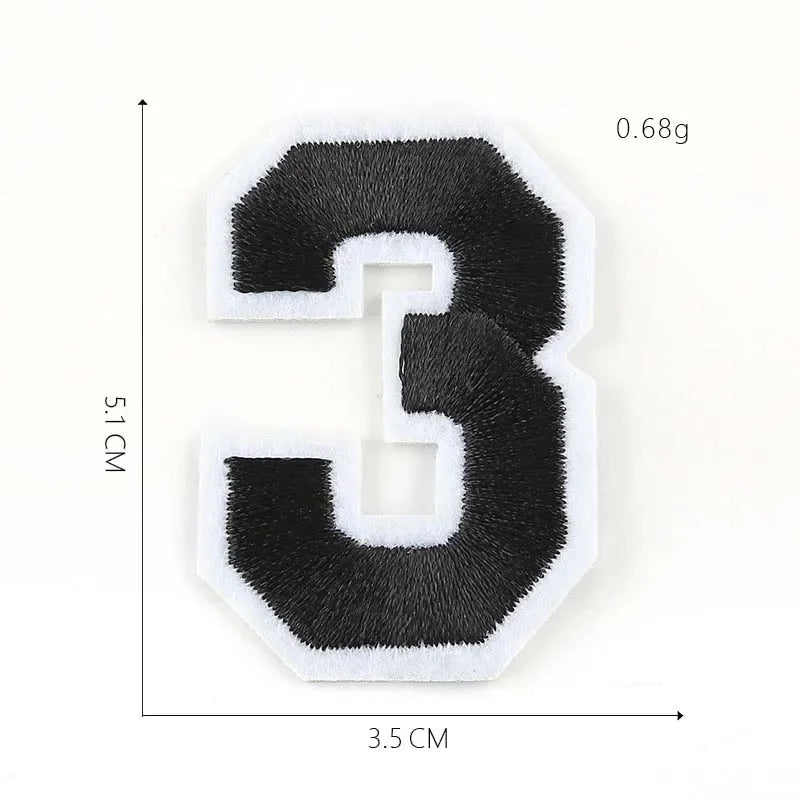 A black iron-on 3D number patch shaped like the digit three, measuring 5.1 cm high and 3.5 cm wide.