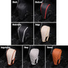 A set of leather gear shift knob covers in black, black red, black white, beige, grey, and brown colors shown individually.