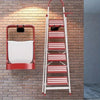 A red and white multi-tiered ladder storage hook mounted on a brick wall.
