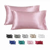 A collection of silky smooth satin pillowcases in various shades including pink, gray, beige, and red.