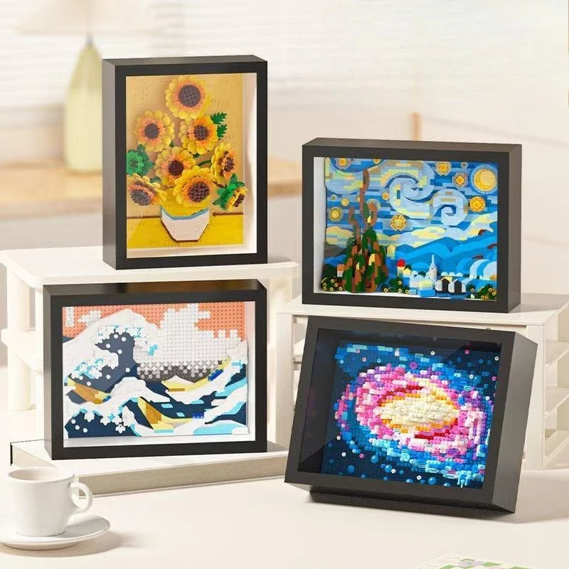 Three framed diamond building blocks featuring Van Gogh's Starry Night and a sunflower painting.