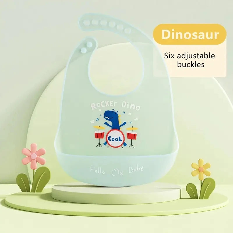 A light blue silicone dinosaur shaped baby bib with six adjustable buckles and a cartoon design.