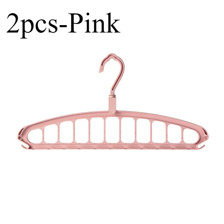 A pink foldable multi-hole space-saving clothes hanger with a hook.