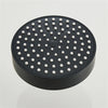 A matte black shower head with multiple small nozzles is shown from above.