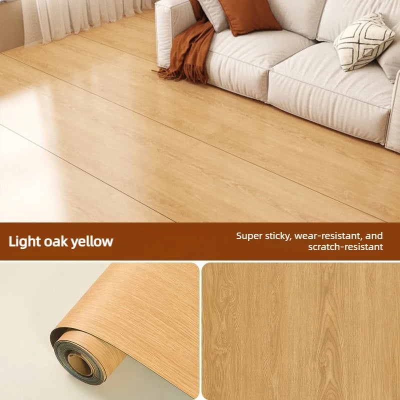 Light oak yellow wood grain self-adhesive floor stickers rolled up and a finished wooden floor surface.