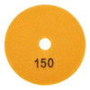 A round, orange polishing pad with the number 150 marked on its surface.