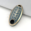 A close-up view of a gold-colored TPU car key case cover with multiple buttons and a key slot.