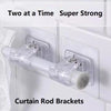 Two clear plastic curtain rod brackets designed to hold a rod, advertised as super strong.