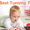 A baby is engaging with high contrast flash cards and a tummy time toy for vision development and muscle strengthening.