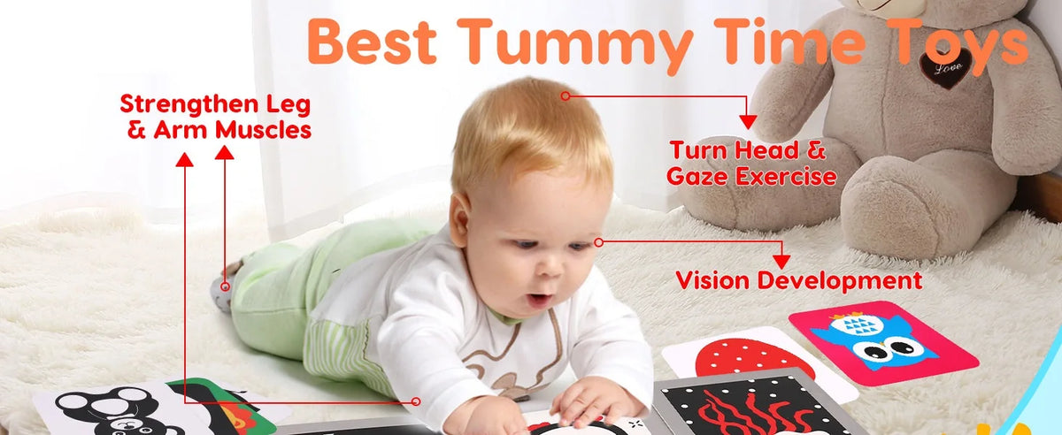 A baby is engaging with high contrast flash cards and a tummy time toy for vision development and muscle strengthening.