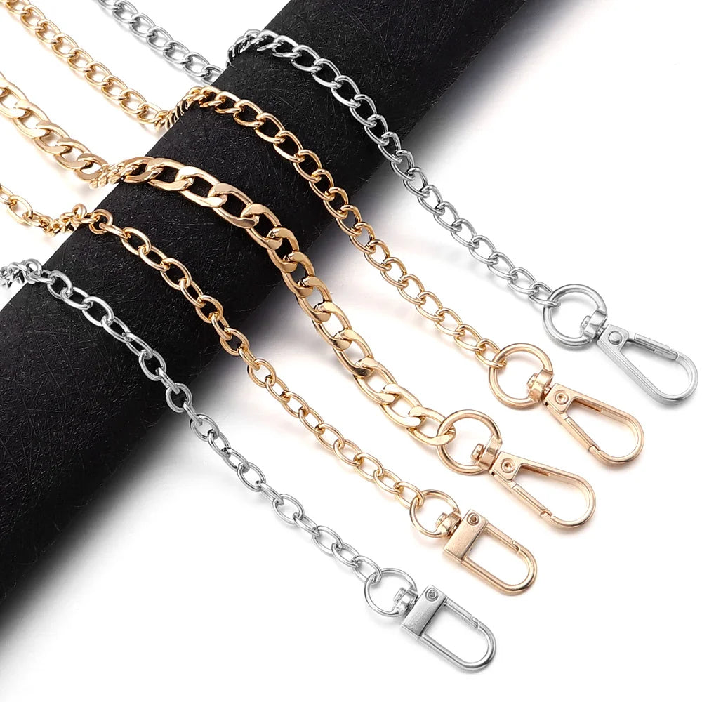 A collection of gold and silver adjustable metal chains and shoulder straps for bags