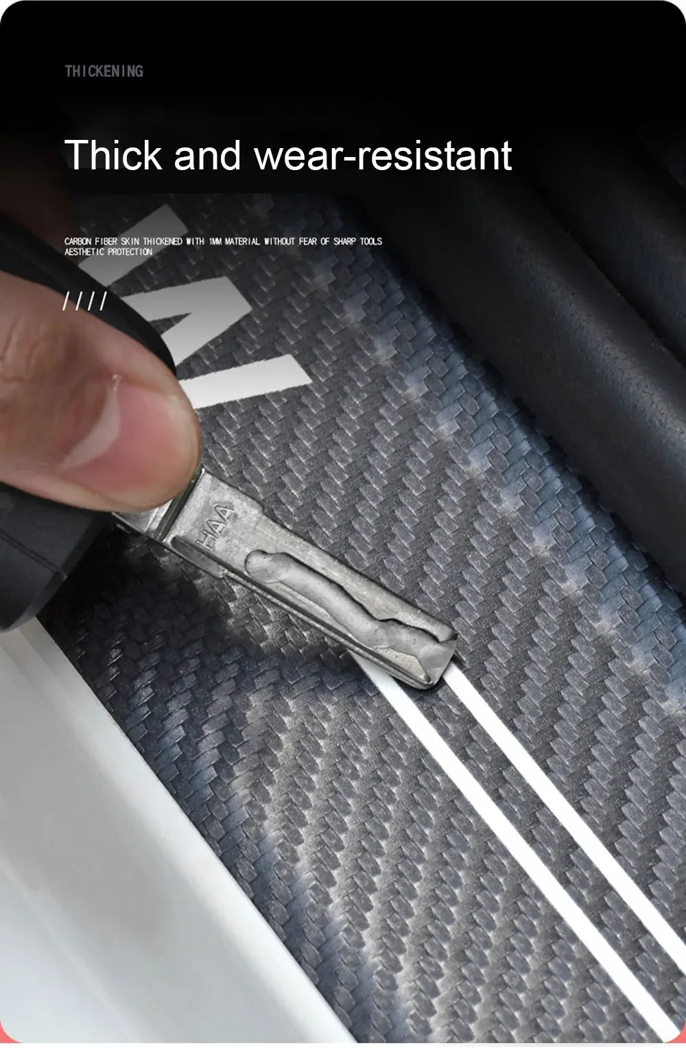 A close-up of a metal door sill protector sticker being applied to a textured surface.