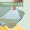 A hand removes a protective film from a car sun visor extender to reveal a clear driving experience.