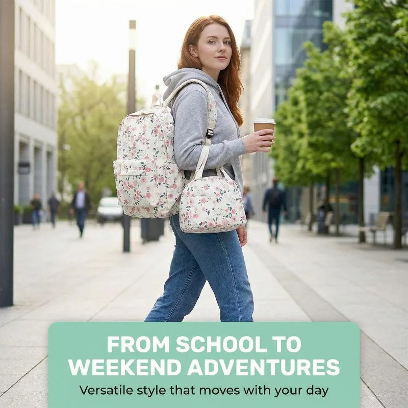 A young woman wearing a gray hoodie and jeans is walking on a city sidewalk carrying a floral backpack.