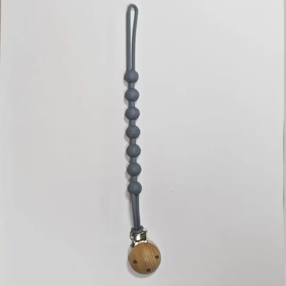 A silicone pacifier clip with a teether, featuring a gray, elongated chain design.
