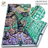 A roll of pink glitter African wax print fabric featuring intricate patterns in purple, green, and black on a white backgroun