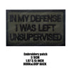 Black embroidered patch with white text reading IN MY DEFENSE I WAS LEFT UNSUPERVISED