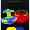 A glowing musical spinning top with a blue body, yellow top, and green accents, set against a dark background.