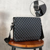 Black patterned crossbody bag displayed on a wooden stool with an inset showing the strap detail.