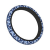 A dark blue and gray camouflage steering wheel cover.