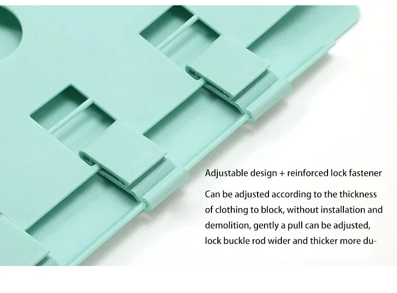 A light mint green folding board with adjustable slots and a reinforced lock fastener for organizing clothing.