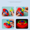 A hand holds a red and blue glowing musical spinning top, demonstrating its vibrant colors and design.