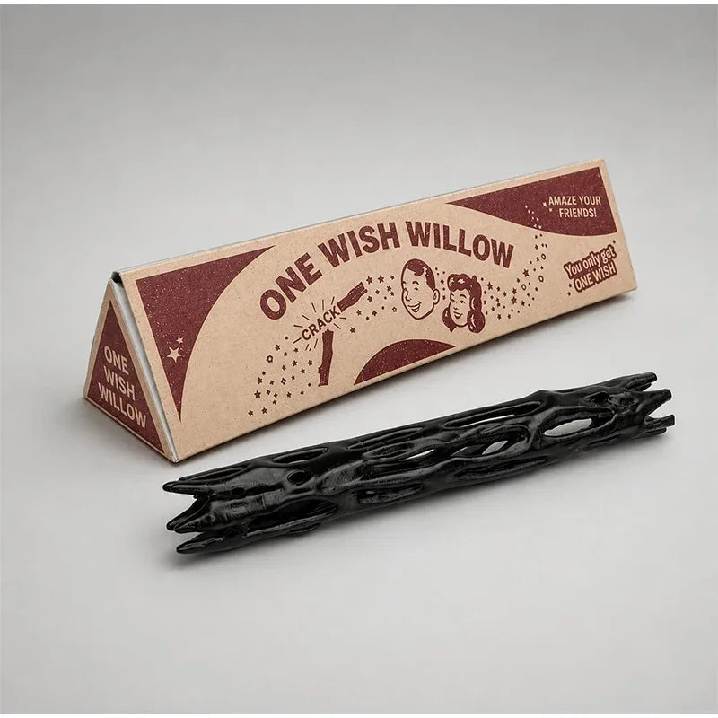 A black willow wood wishing stick is displayed next to its gift box featuring the text One Wish Willow.