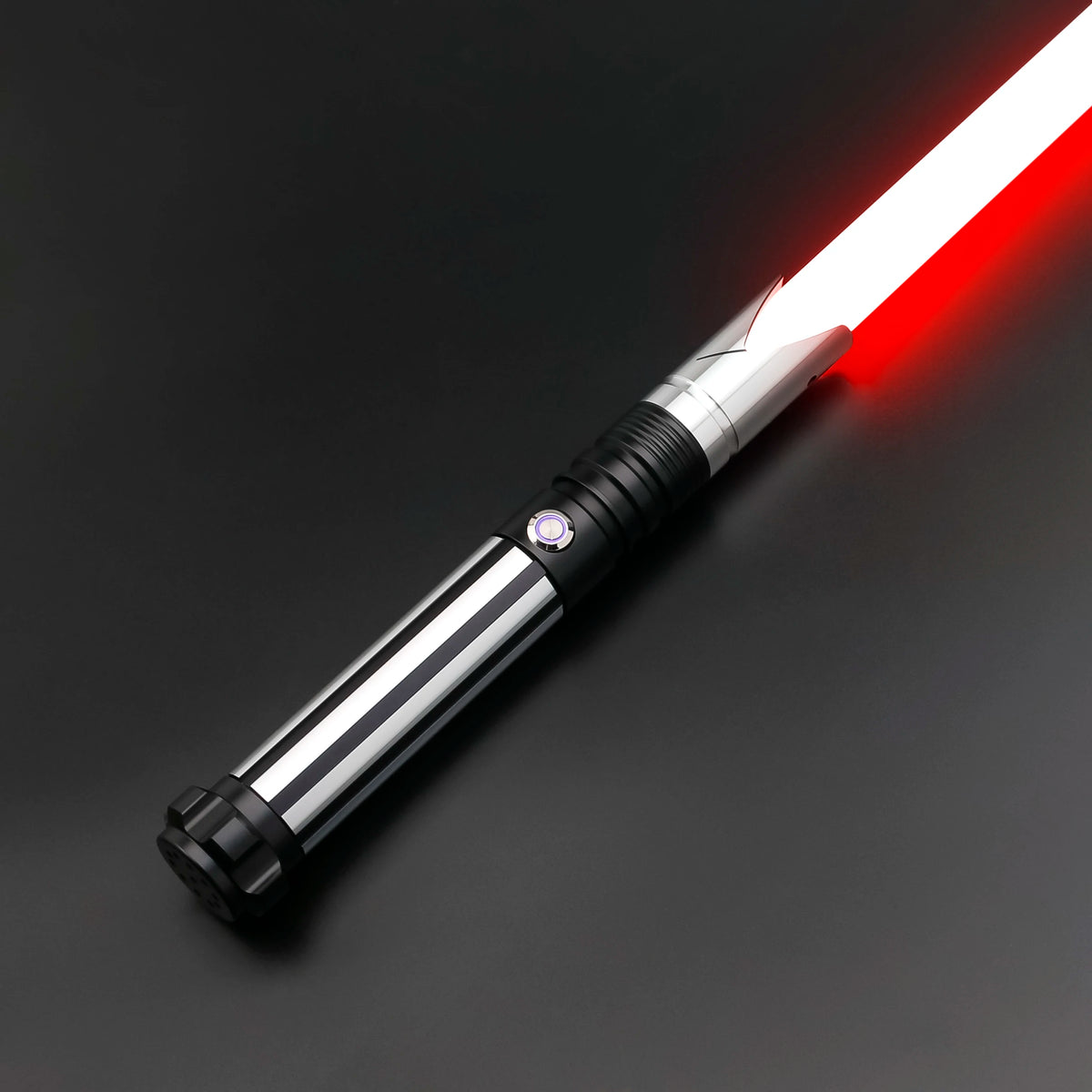 A close-up view of a Neo Pixel lightsaber with a glowing red blade and silver hilt against a dark background.