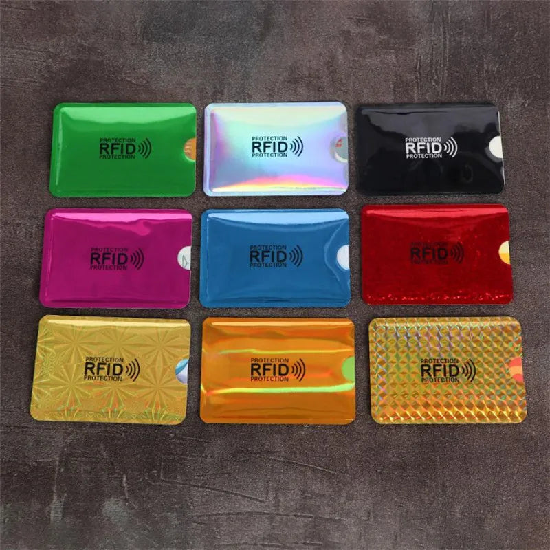 A collection of nine colored RFID blocking aluminum card holders arranged in a grid.