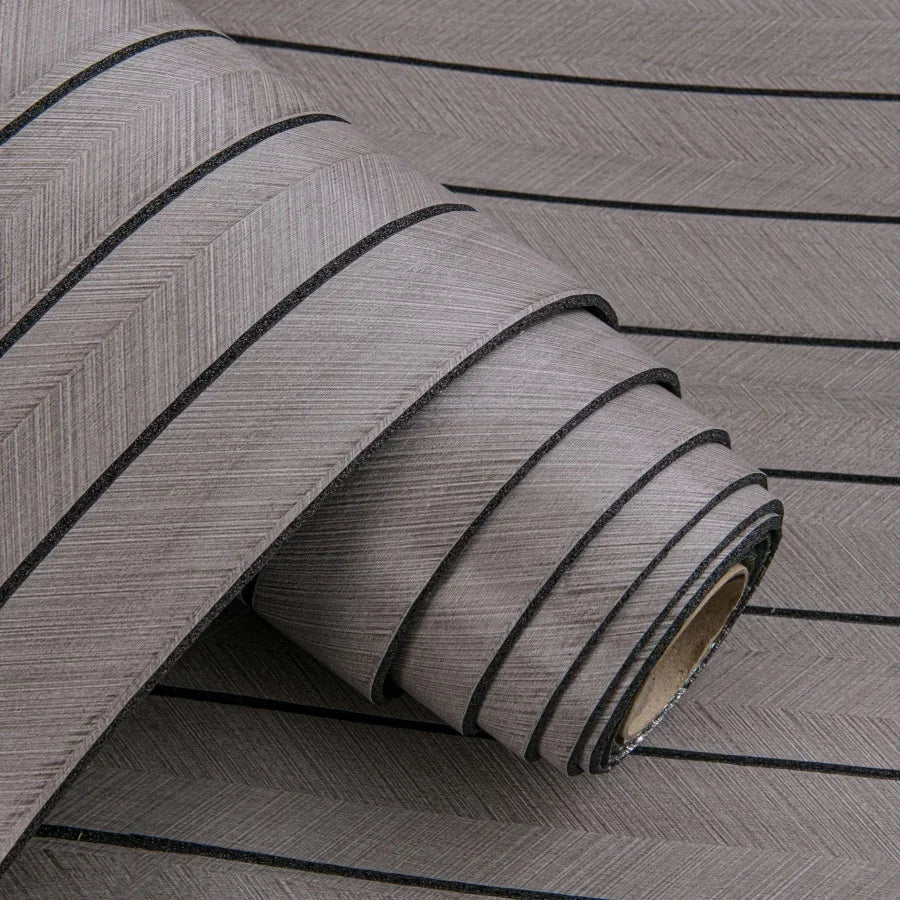 Roll of gray 3D grille pattern peel-and-stick wallpaper shown in a close-up view.